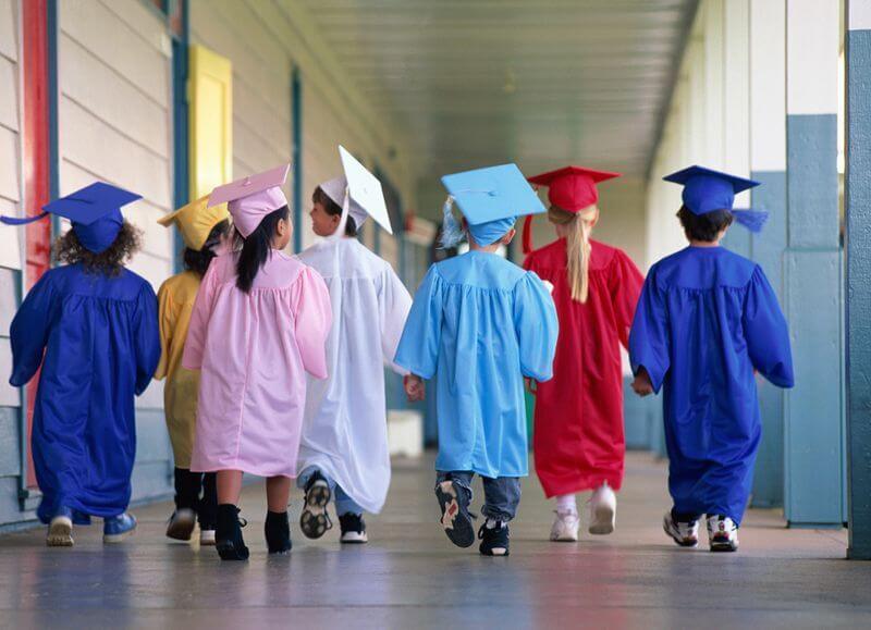 Group of kids in graduation outfits